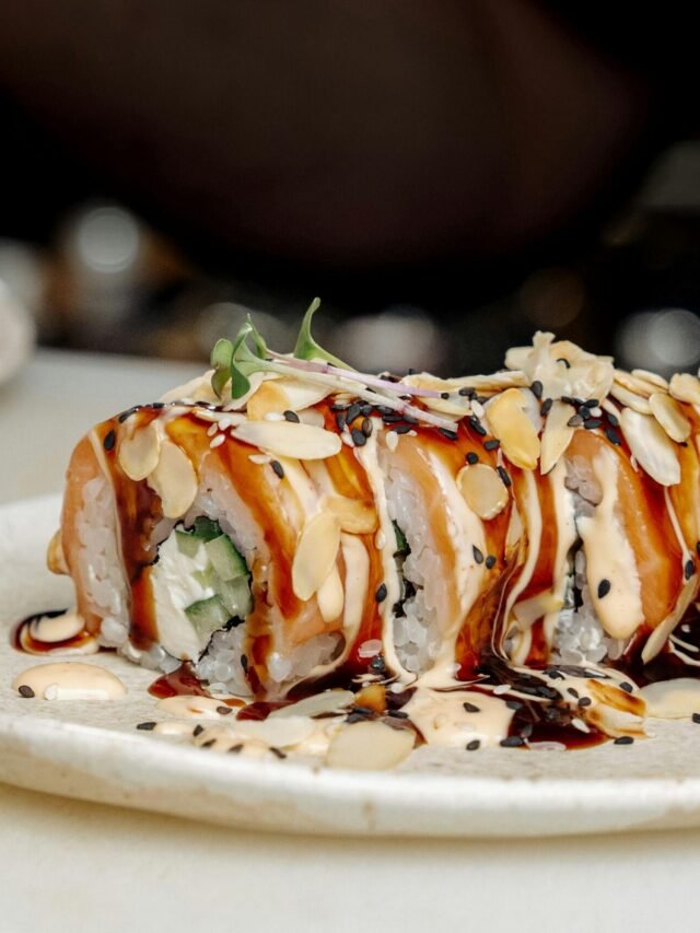 Sushi Roll with Garnish on White Ceramic Plate